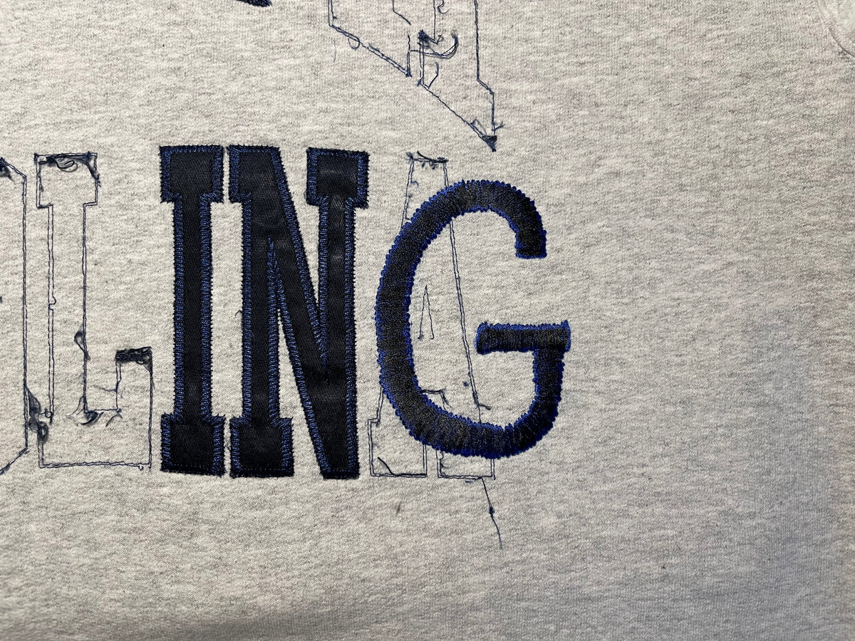 NOT CARING collegiate REsweatshirt